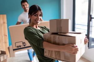 Woman carrying moving box