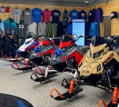 Lakes Area Powersports showroom with snowmobiles and clothing